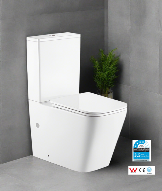 White toilet with water efficiency label on a gray tiled wall