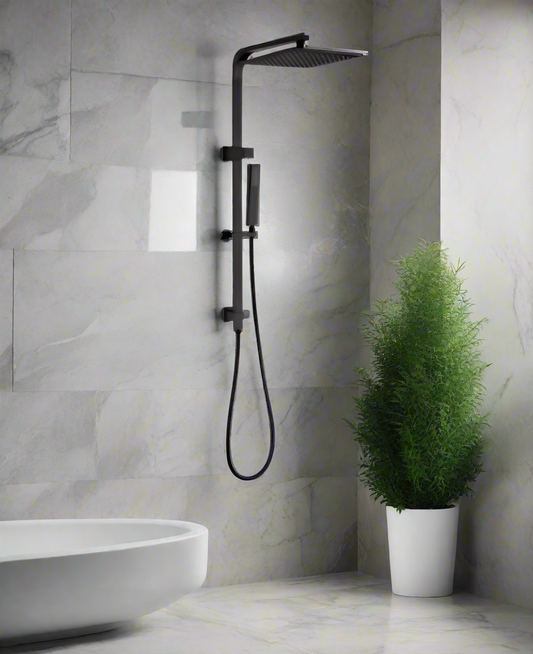 A modern matte black 10-inch twin shower head set with a handheld spray, installed in a bathroom with marble walls, next to a bathtub and a potted plant.