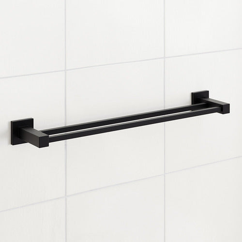 Black towel bar mounted on a white tiled wall