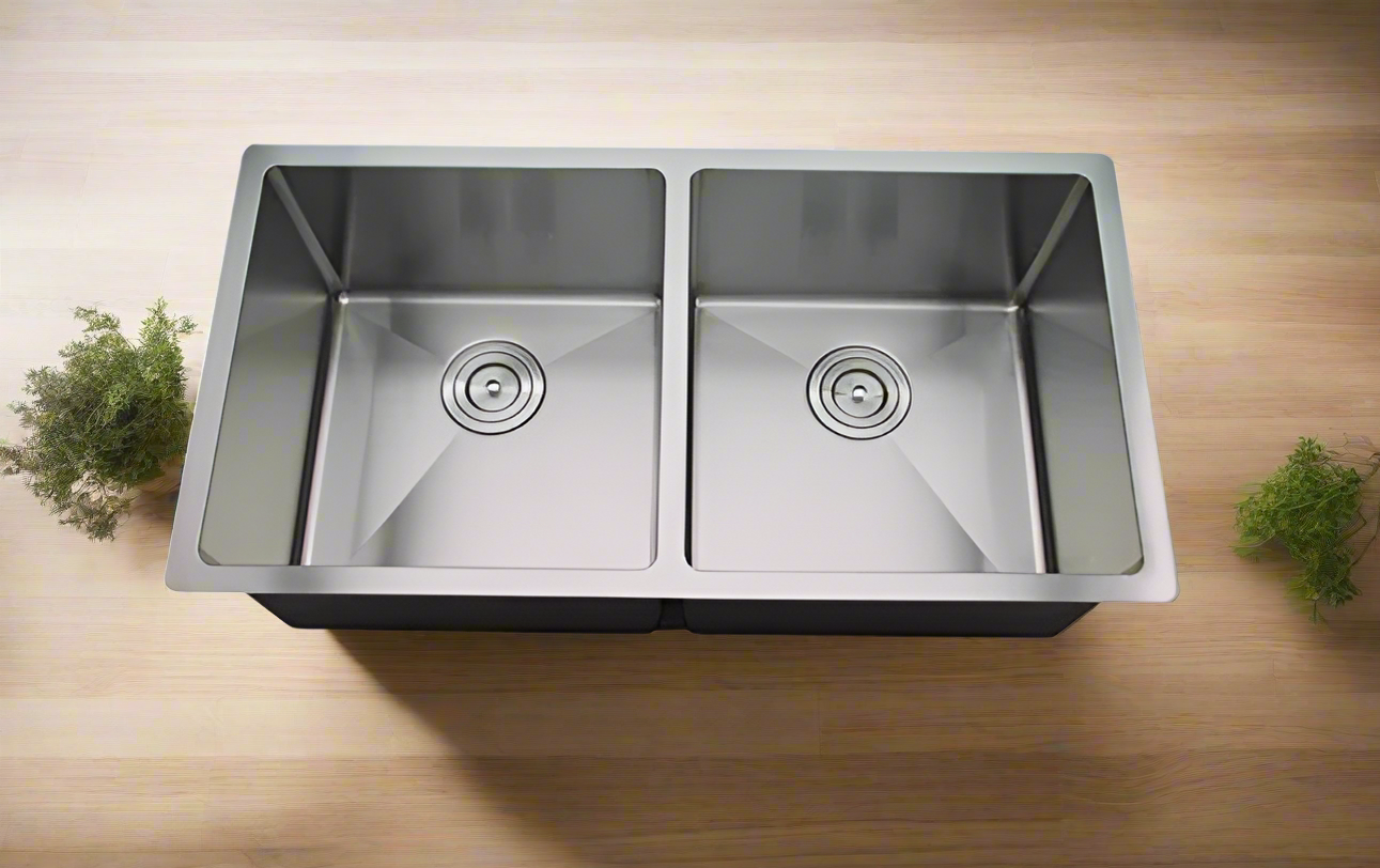 A double stainless steel kitchen sink with a scratch-proof, oil-proof, and bacteria-free nano-coated surface, installed in a kitchen setting.