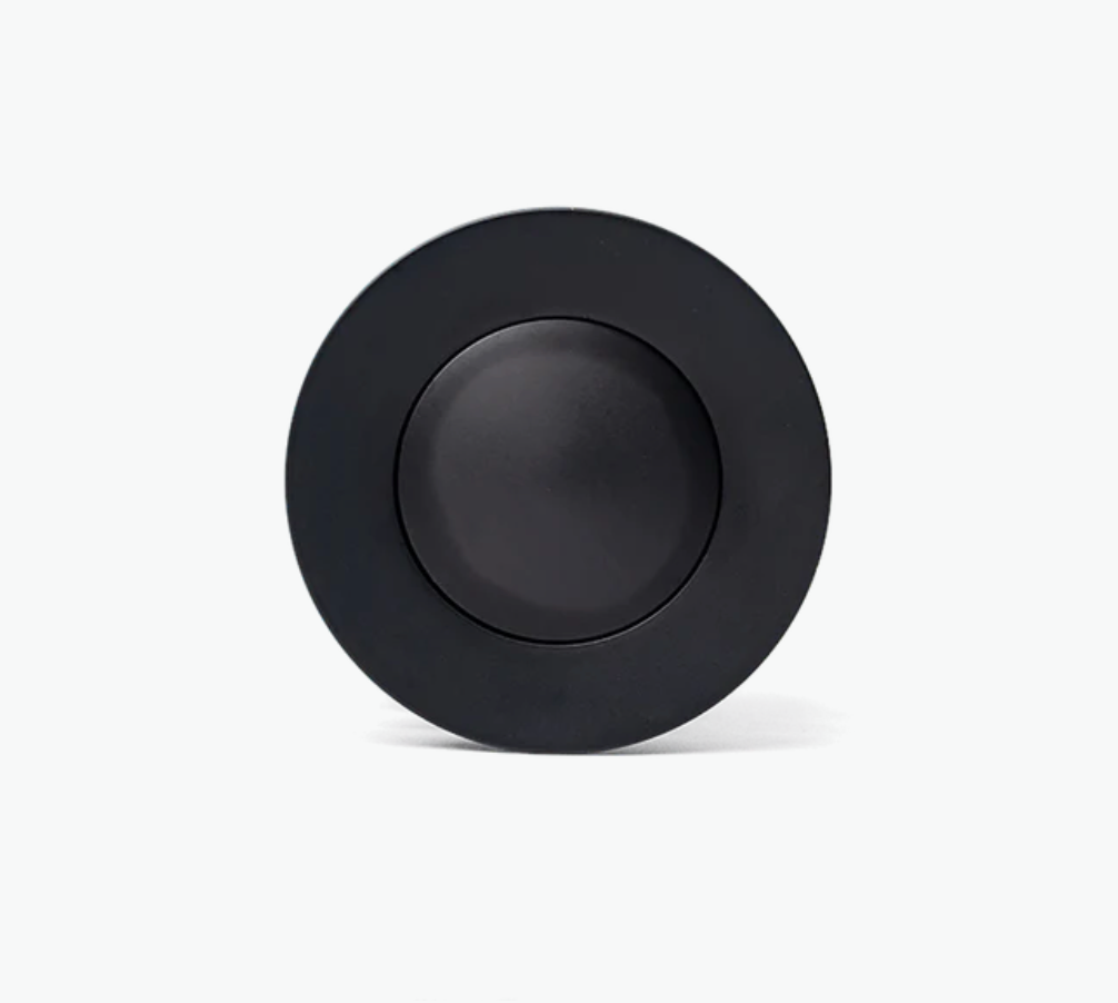 Black circular object on a white background