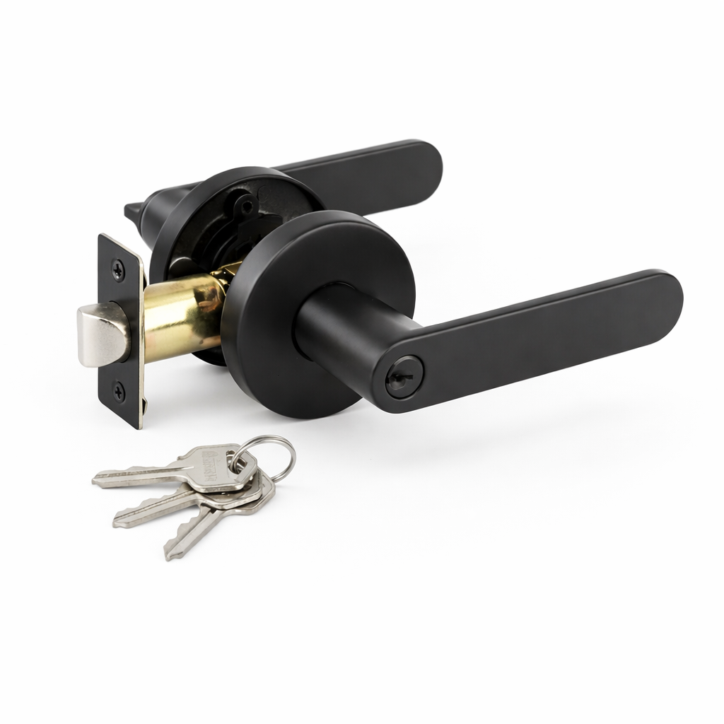 Black door handle with brass interior and keys on a white background