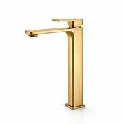 Gold faucet on a white background