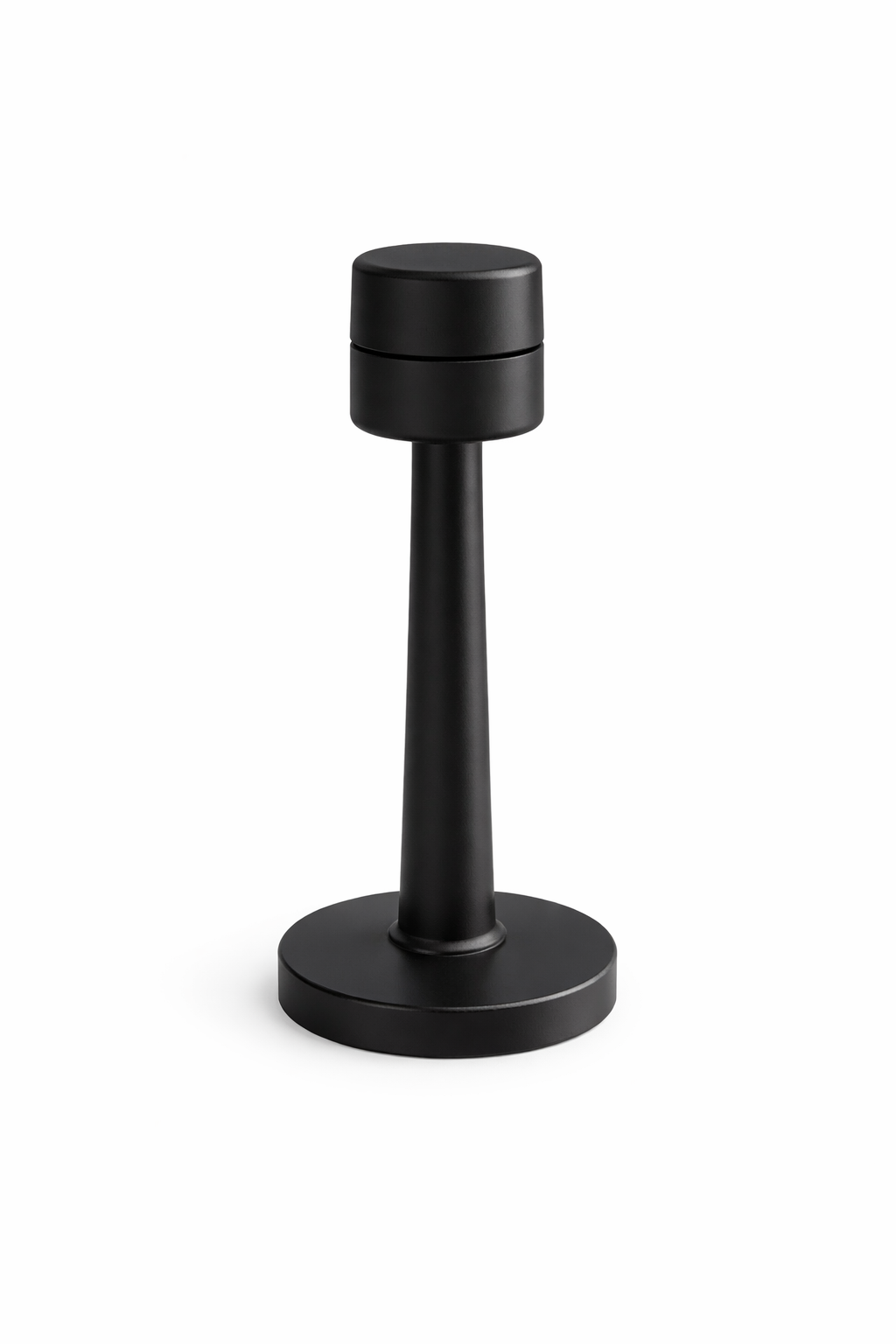 Black cylindrical object on a white background