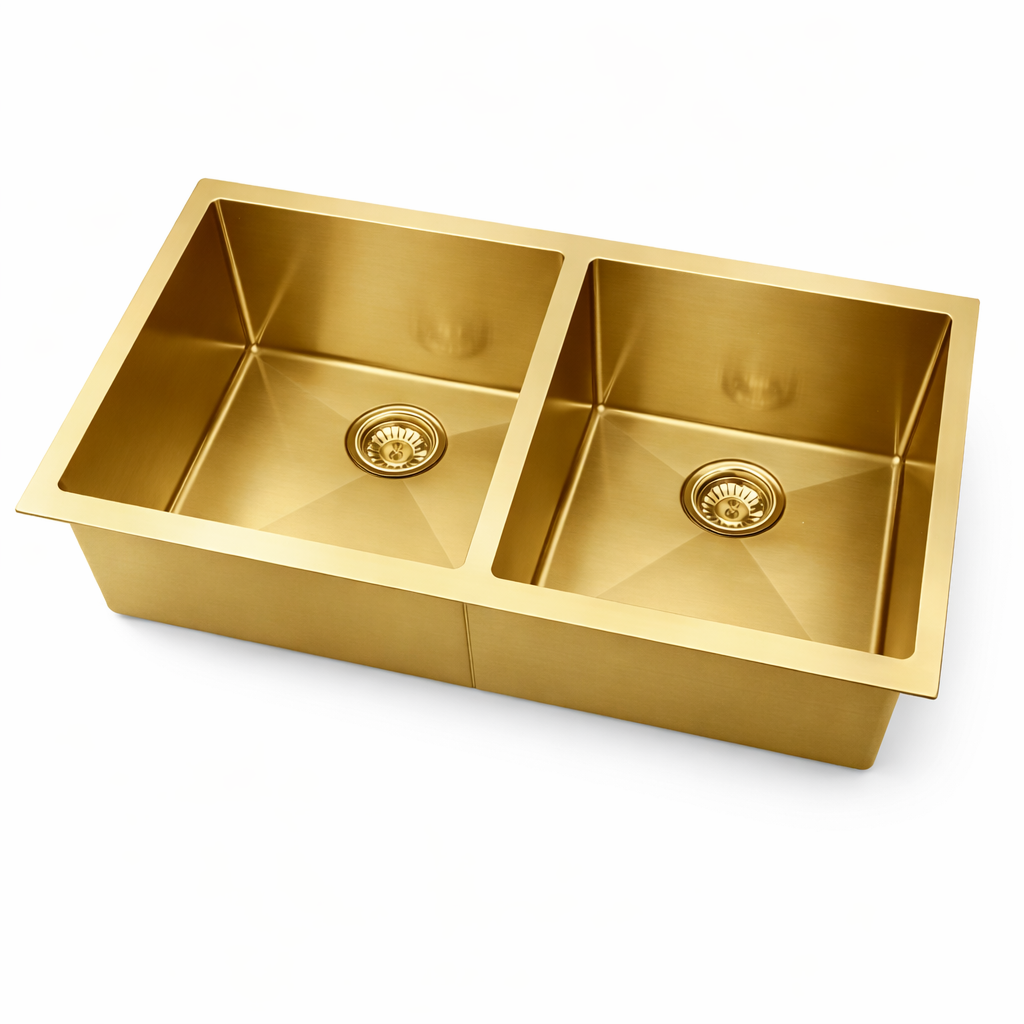 Gold kitchen sink on a white background
