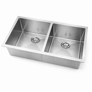 Stainless steel kitchen sink on a white background