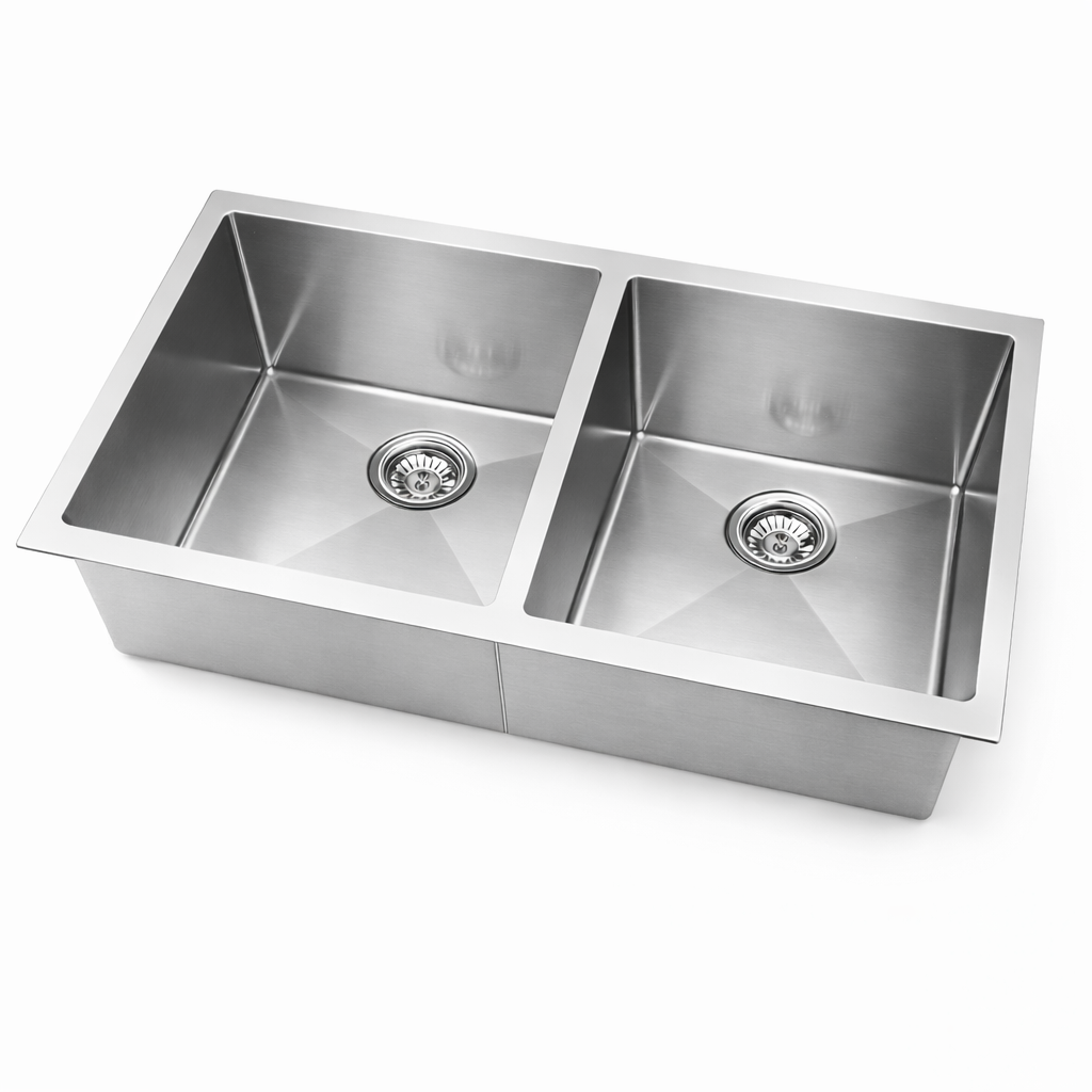 Stainless steel kitchen sink on a white background