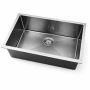 Stainless steel kitchen sink on a white background