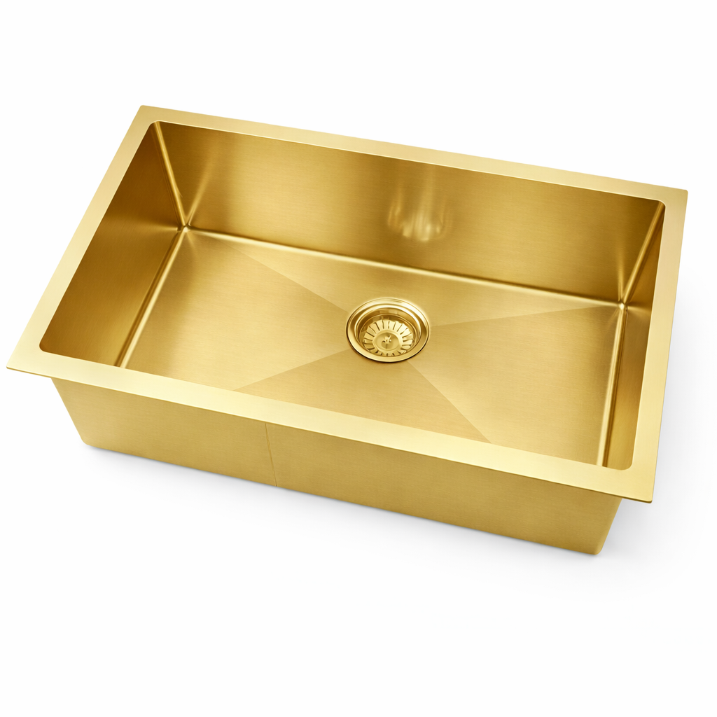 Gold kitchen sink on a white background