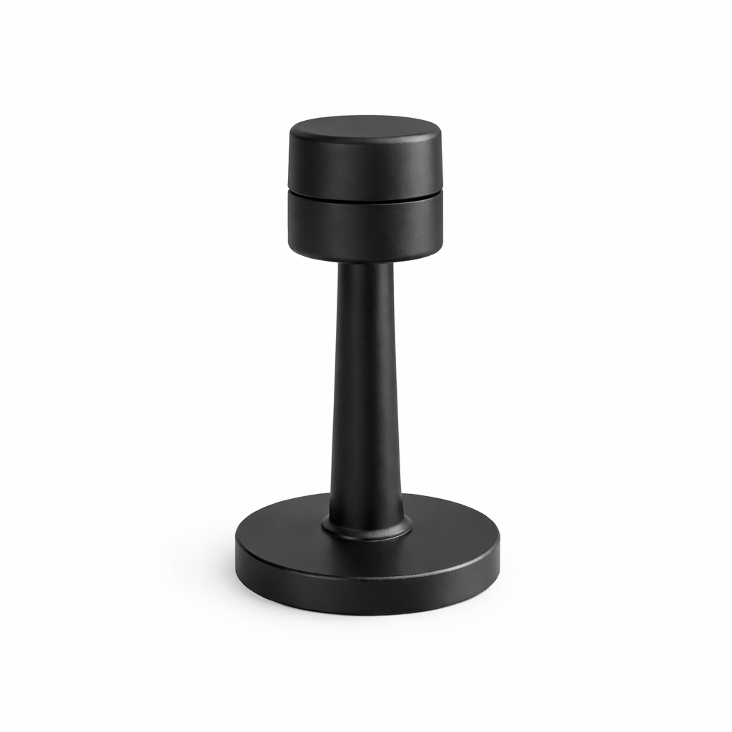 Black cylindrical object on a white background