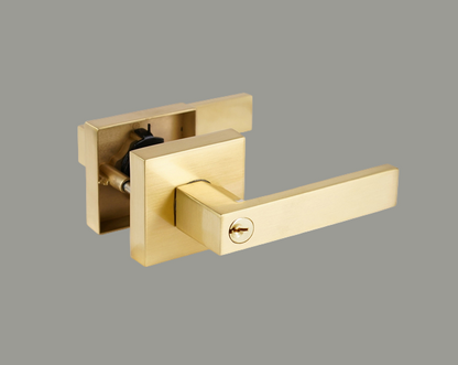 Gold door handle on a white background