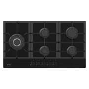 Black gas cooktop with five burners on a white background
