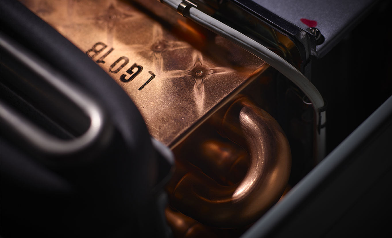 Close-up of a metallic component with 'Legion' branding on a dark background