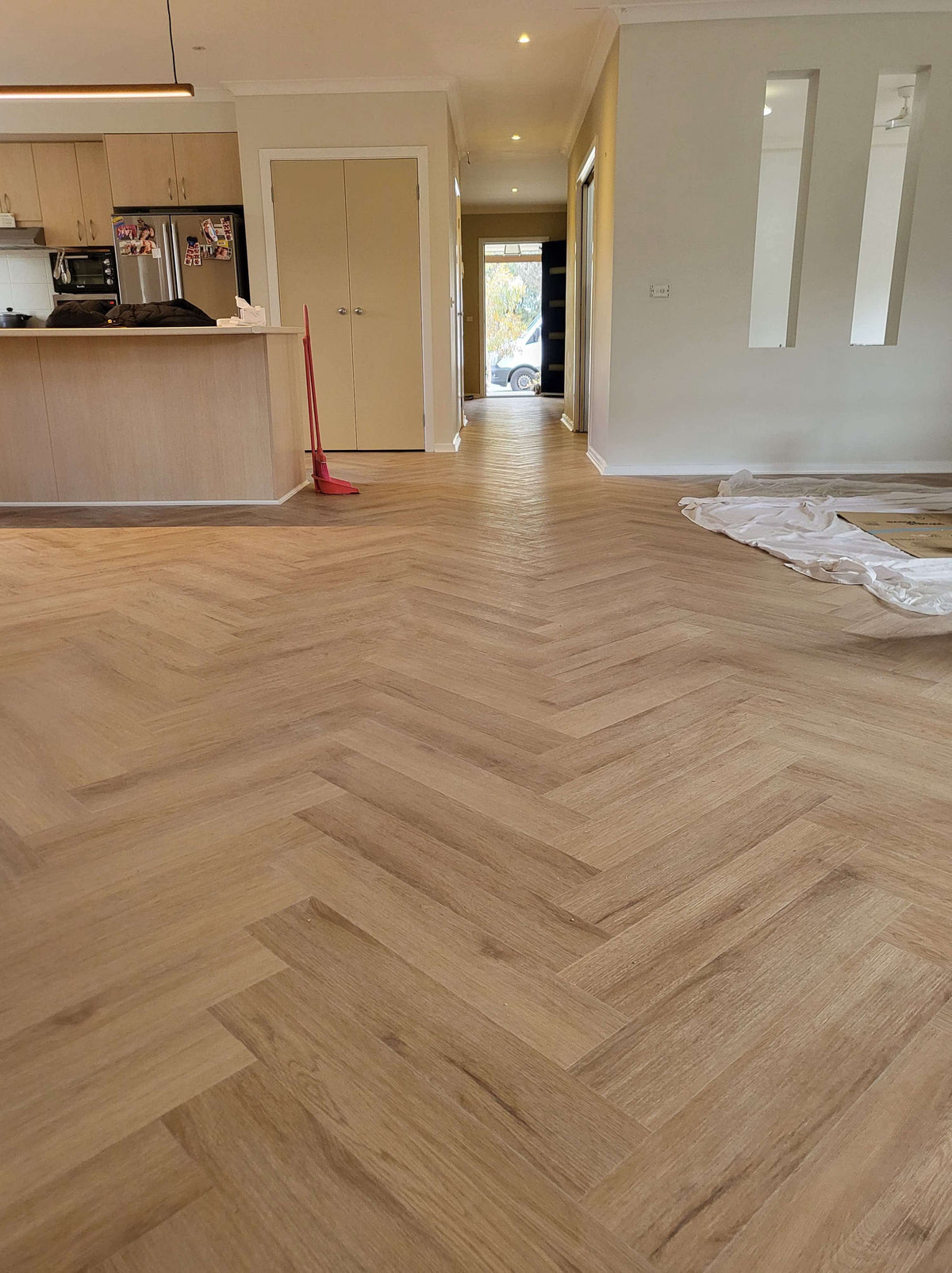 Blackbutt hybrid herringbone flooring installed in an open-plan Australian home