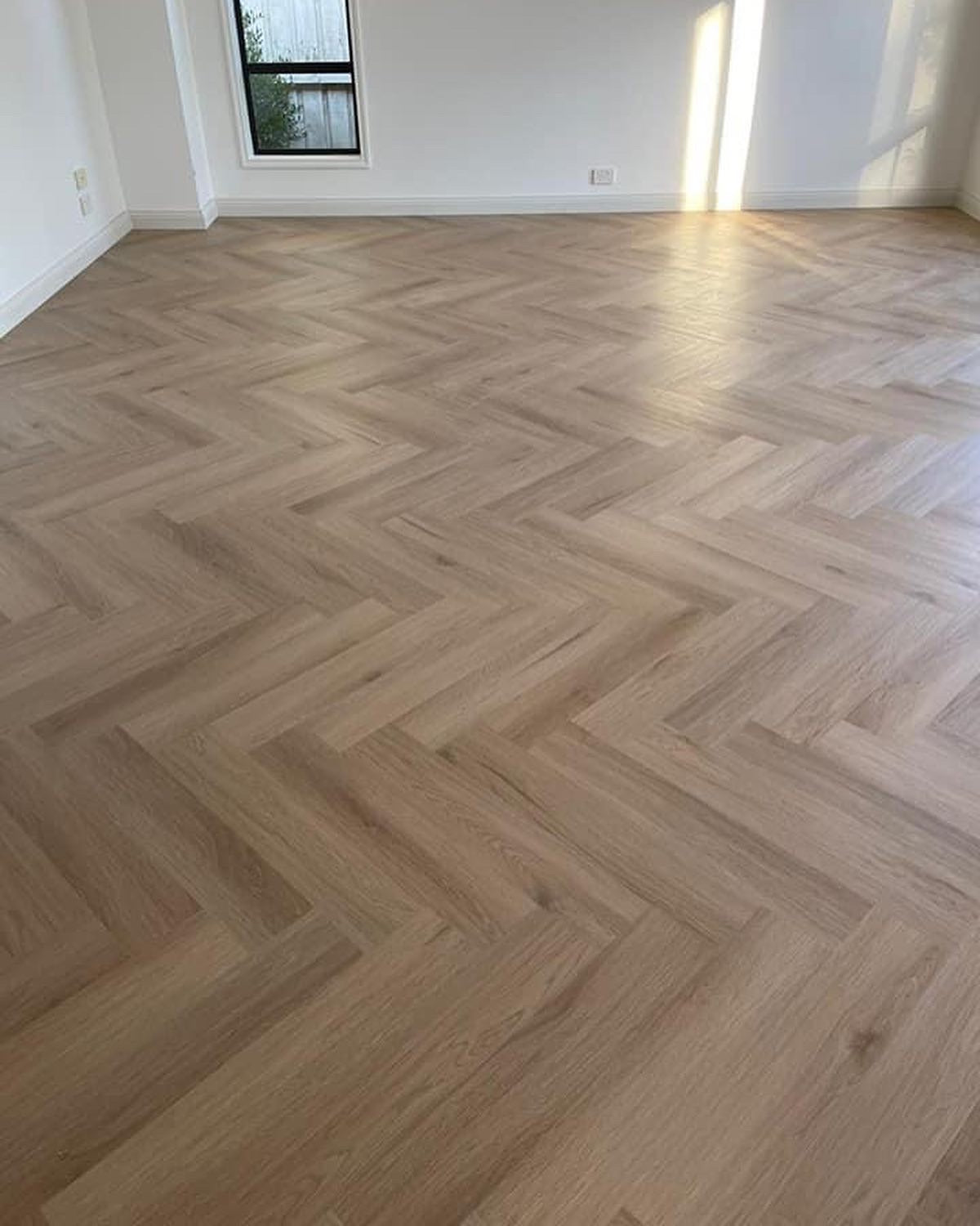 Classic Oak Hybrid Herringbone Flooring 7mm installed in a contemporary interior