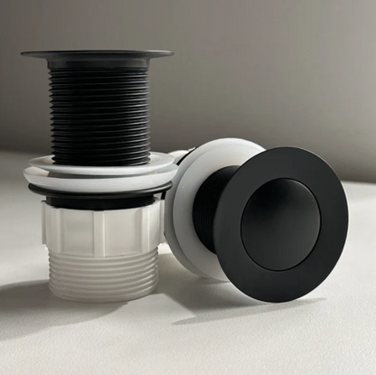 Bath plug with black and white design 