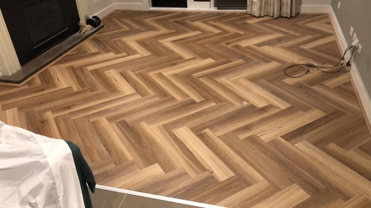 Spotted Gum Hybrid Herringbone Flooring 7mm installed in a contemporary interior