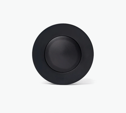 Black circular object on a white background