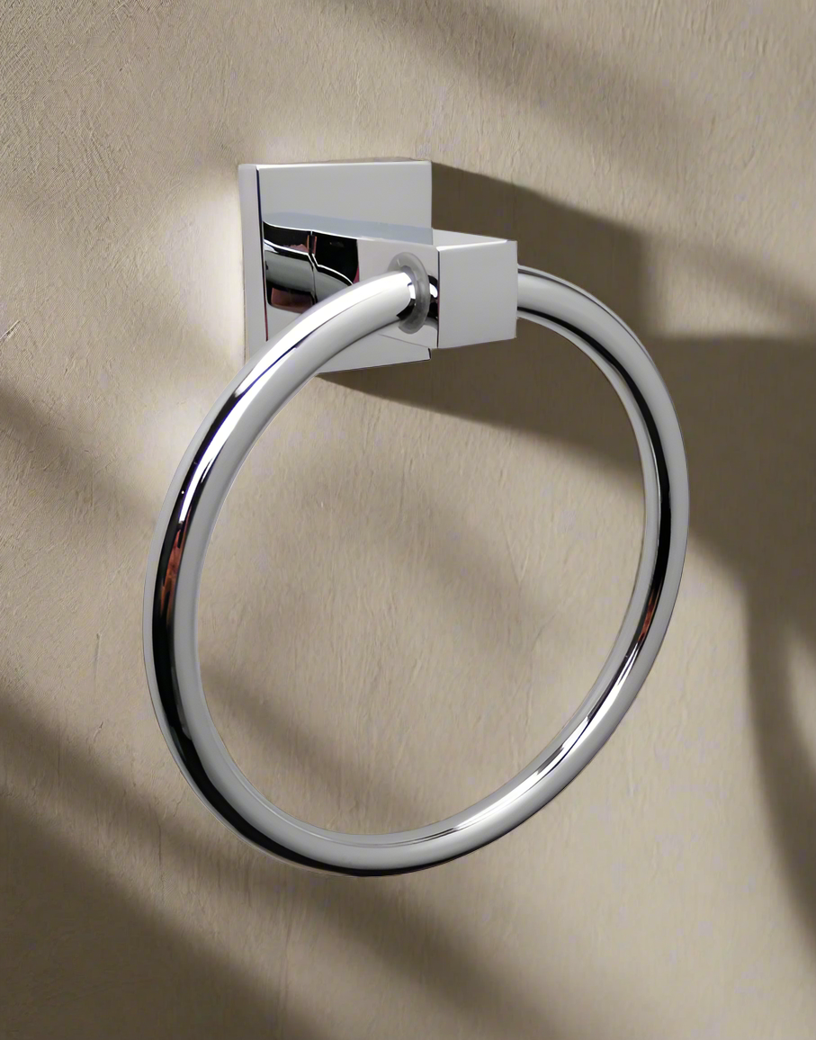 A white stainless steel hand towel holder ring .