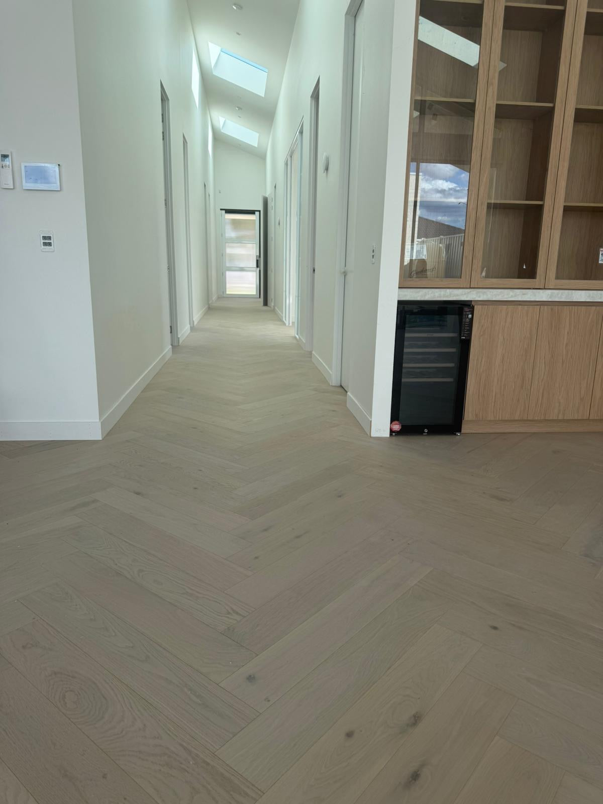 White Wash Oak engineered timber herringbone flooring installed in a modern hallway